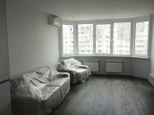 Фото ремонта квартиры на улице Е.Чавдар в Киеве - гостиная с мебелью